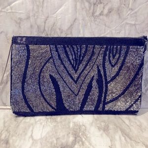 Black and silver beaded bag with a long strap,